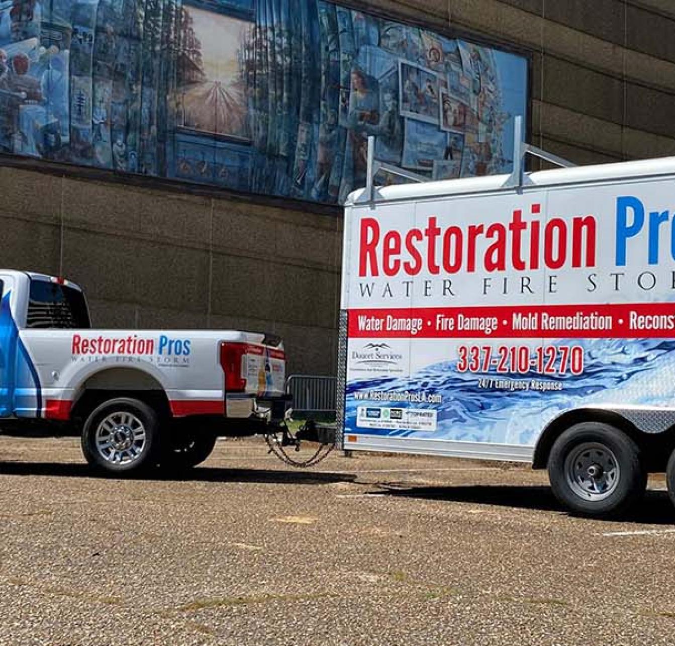 image of Restoration Pro company truck and trailer in parking lot of Lafayette, LA